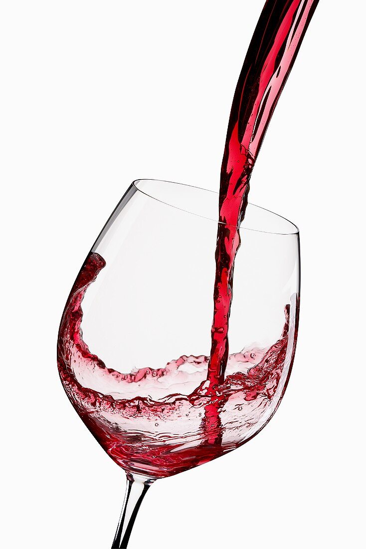 Pouring Red Wine into a Glass