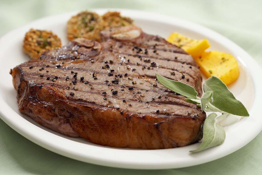 A Grilled Porterhouse Steak with Cracked Black Pepper