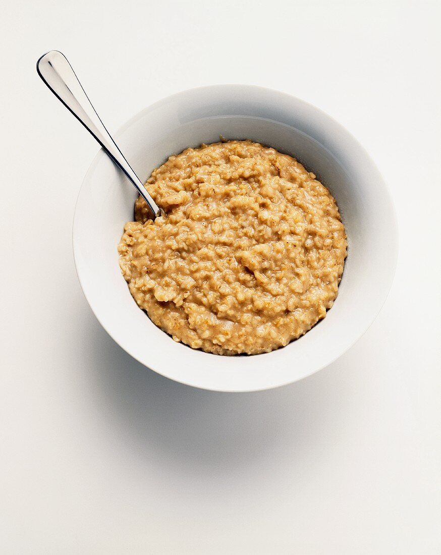 Bowl of Oatmeal on a White Background; From Above
