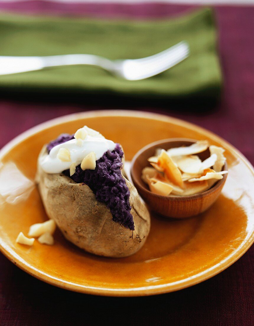 A Baked Purple Sweet Potato with Sour Cream