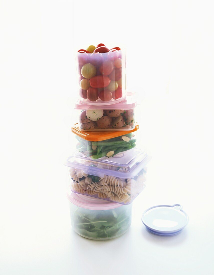 A Stack of Storage Containers Filled with Various Foods