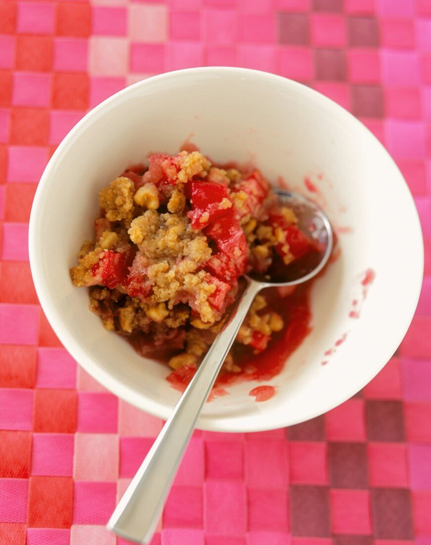 A Bowl of Cranberry Apple Crisp with Spoon