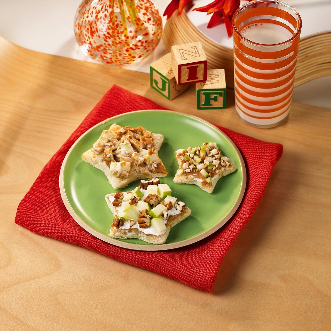 White Bread Stars Topped with Apples, Pecans and Peanut Butter