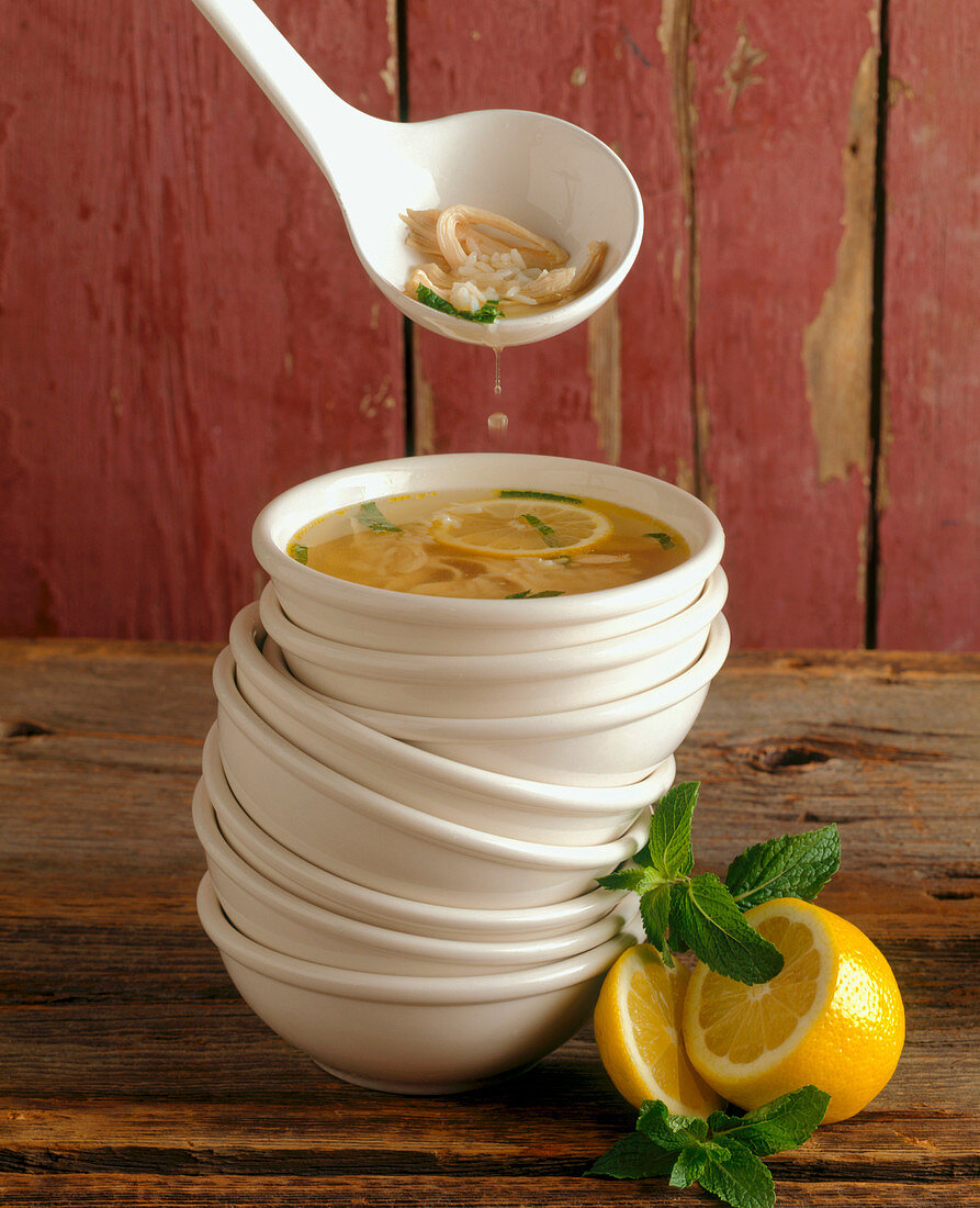 Chicken, Lemon and Rice Soup in a Stack of Bowls