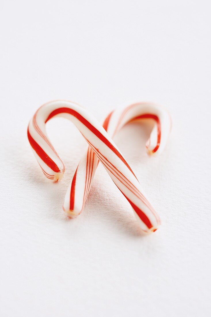 Two Candy Canes on a White Background