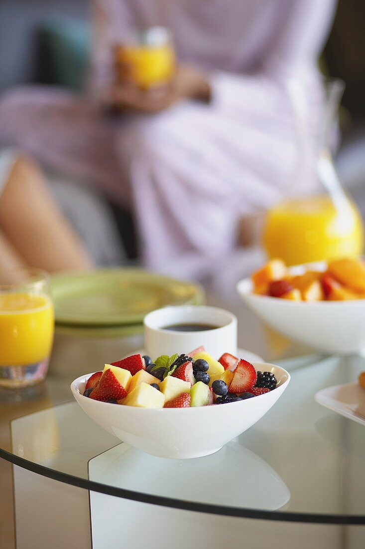 Fruit Salad, Coffee and Orange Juice on a Coffee Table