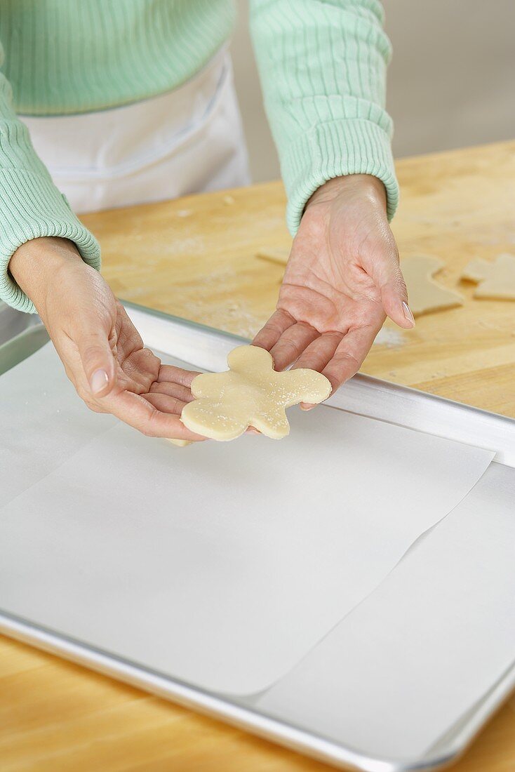 Placing an Unbaked Cookie on a Cookie Sheet