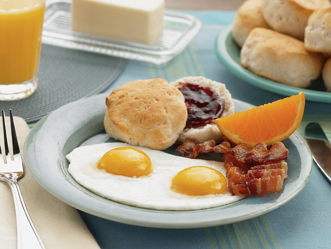 Two Eggs Over Easy with Bacon and a Biscuit with Jam