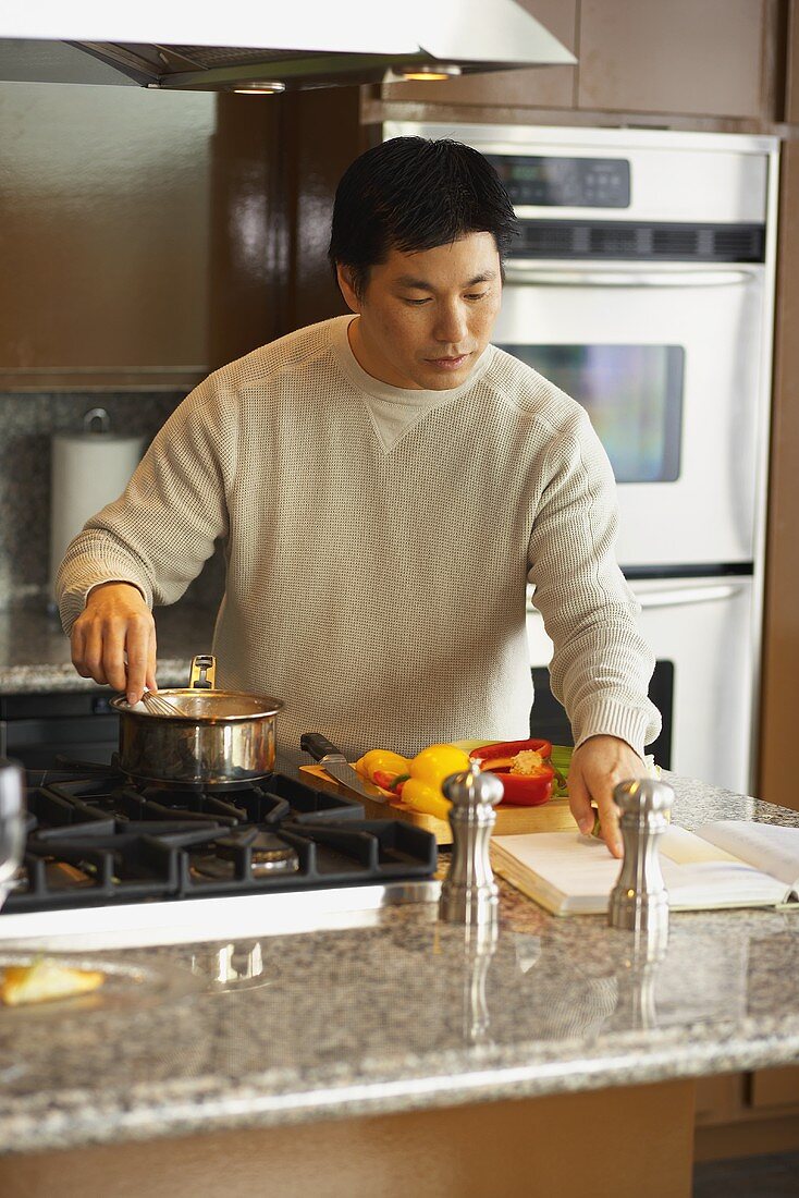 Man cooking vegetables in a kitchen