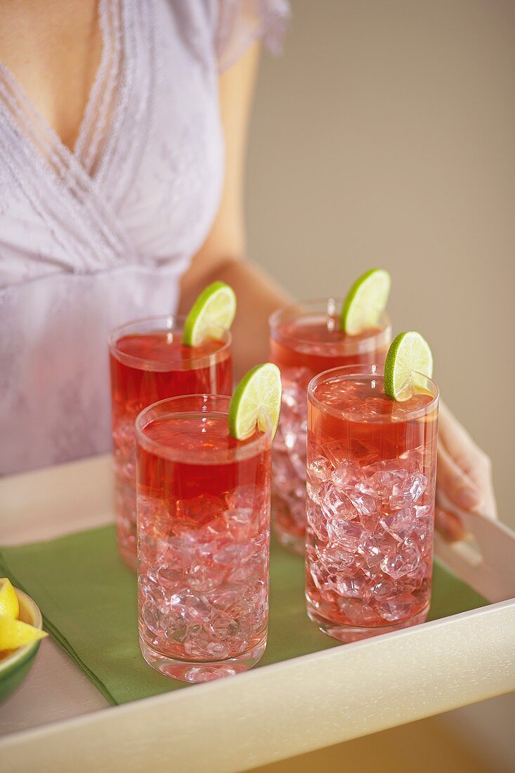 A Woman Carrying a Tray of Drinks