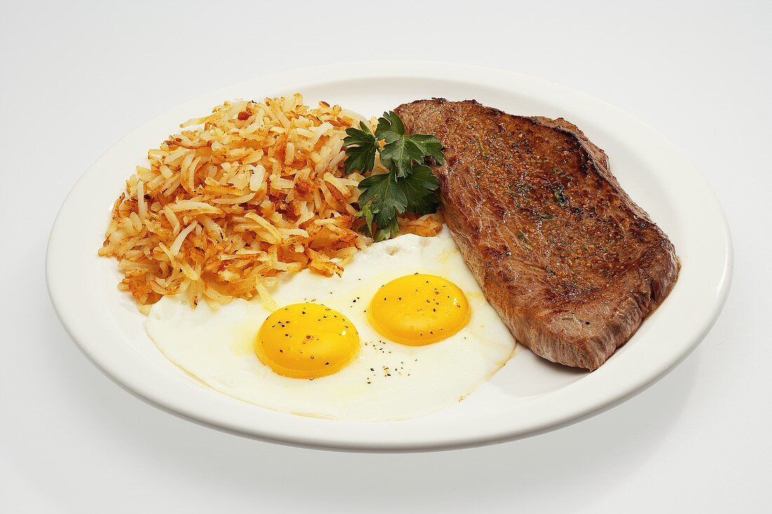 Fried Eggs with Steak and Shredded Homefried Potatoes