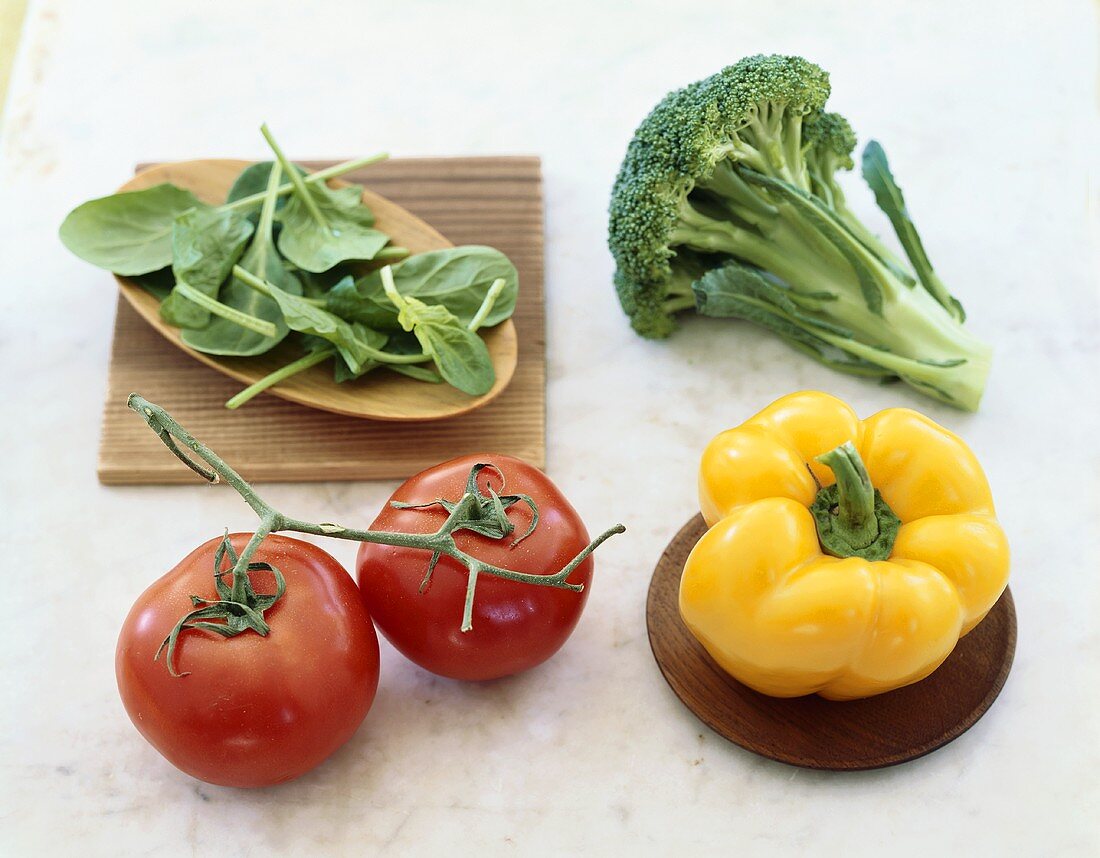 Vegetable Still Life with Vine Ripened Tomatoes, a Yellow Bell Pepper, Broccoli and Arugula