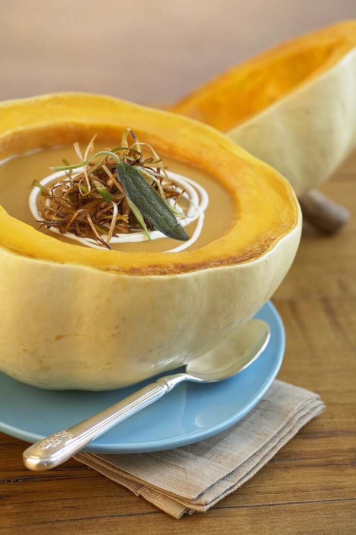 Pumpkin soup with fried onions in hollowed-out pumpkin