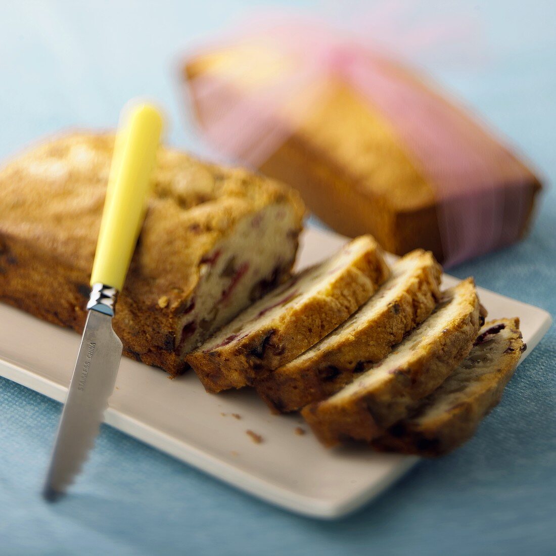 A Partially Sliced Loaf of Apple Cranberry Bread