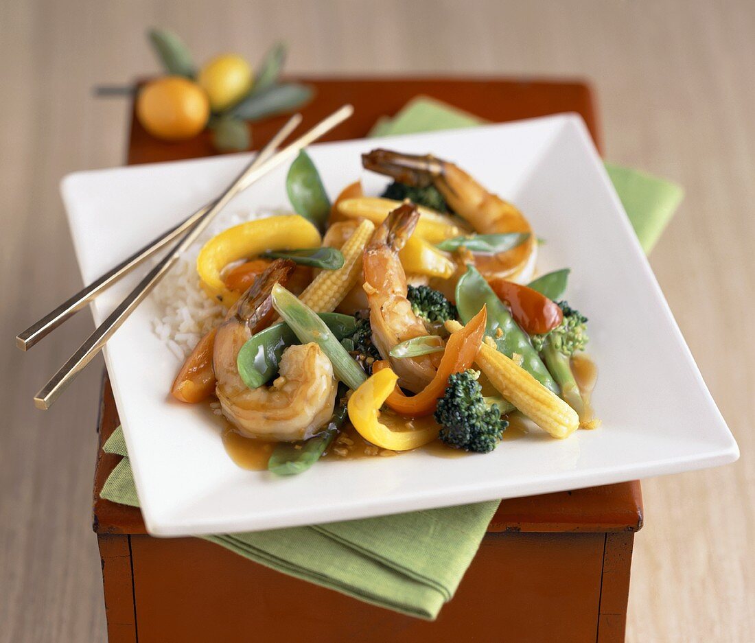 Shrimp Stir Fry on a Square White Plate with Chopsticks