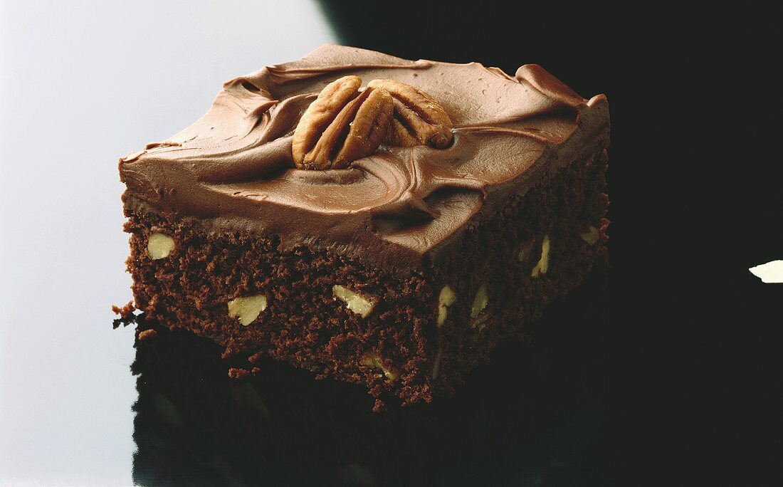 A piece of chocolate pecan cake