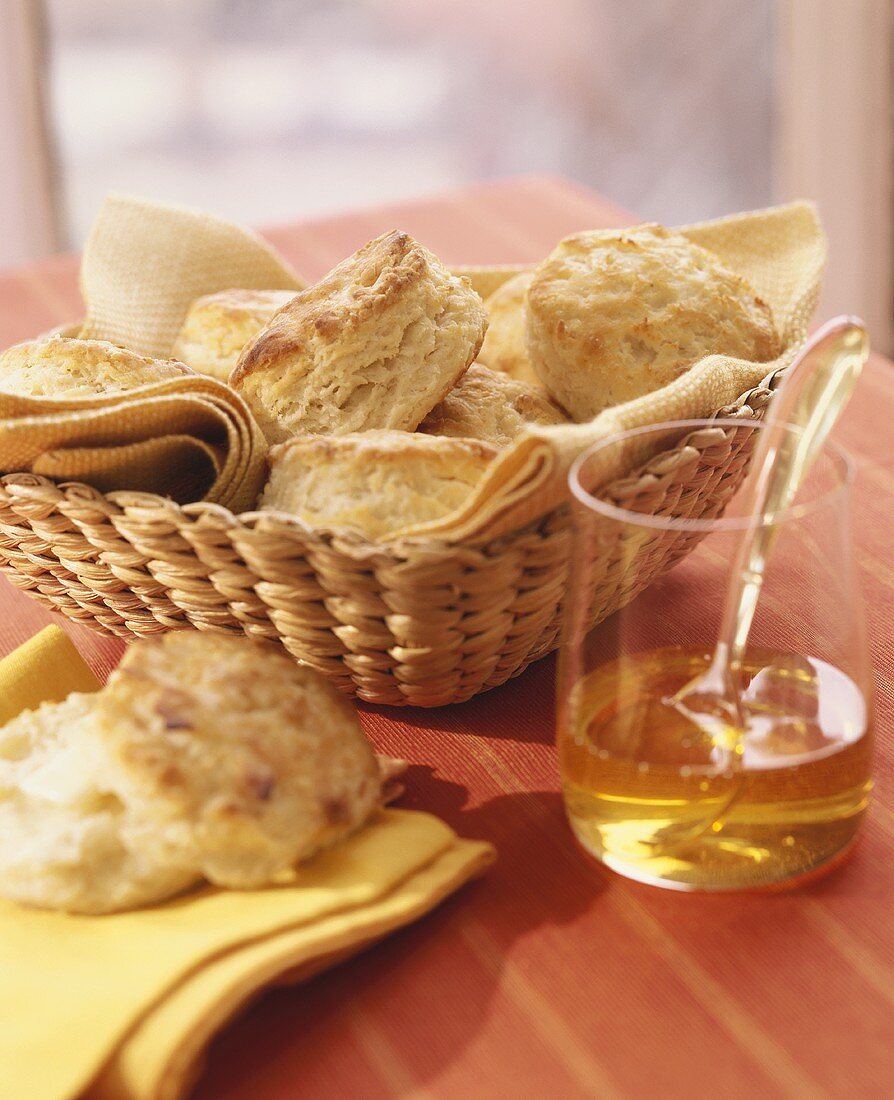 Homemade Biscuits in a Basket with Honey