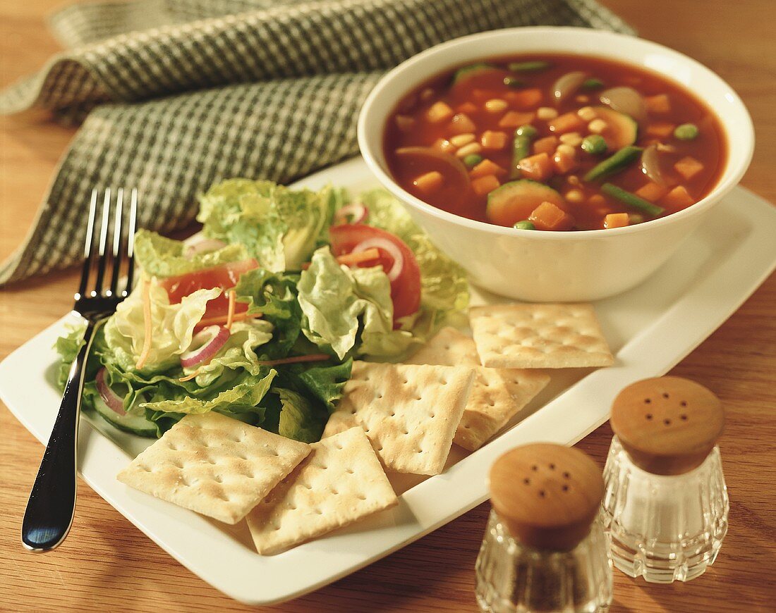 Vegetable soup with salad and crackers