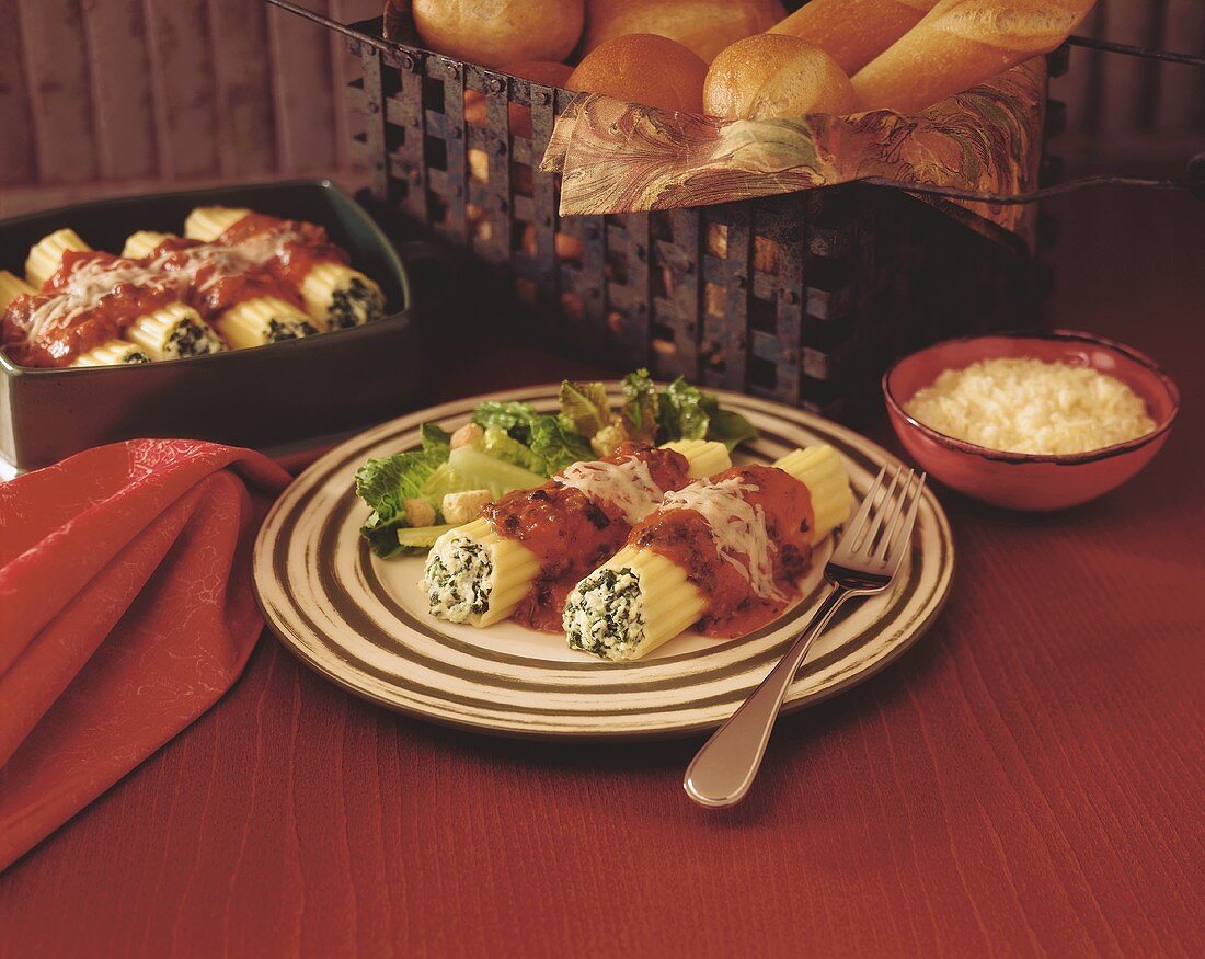 A serving of spinach cannelloni with salad