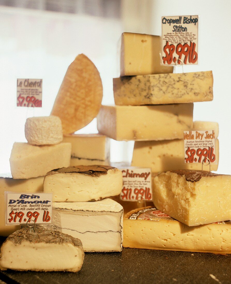 A Variety of Cheese Wedges at a Market