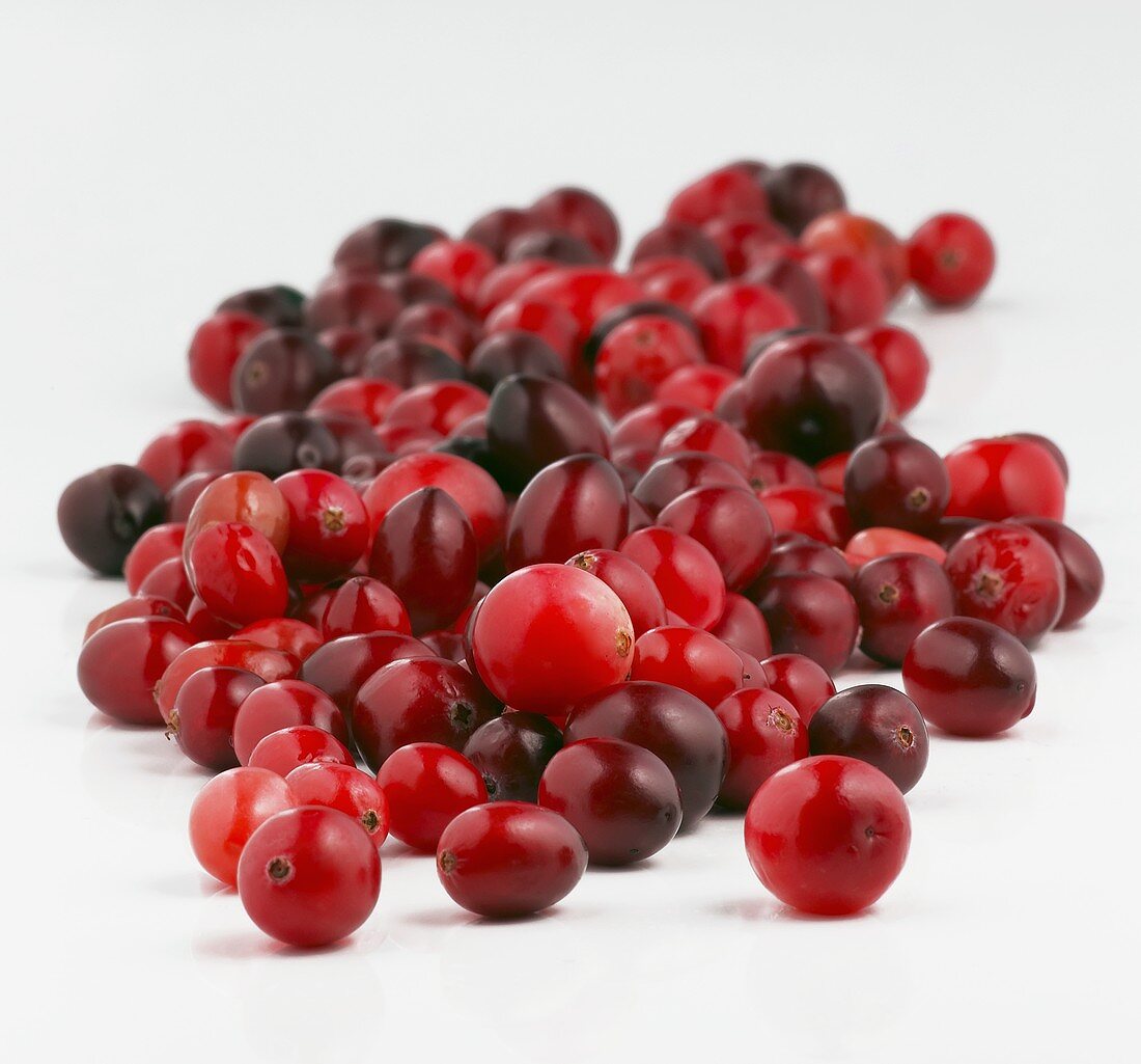 Many Fresh Cranberries on a White Background