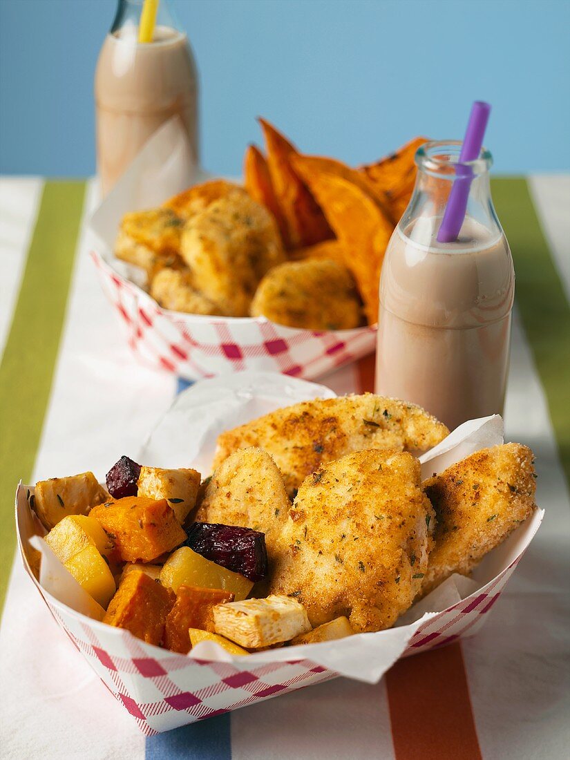 Fried Chicken Fillet Pieces with Assorted Roasted Root Vegetables in a Take Out Container