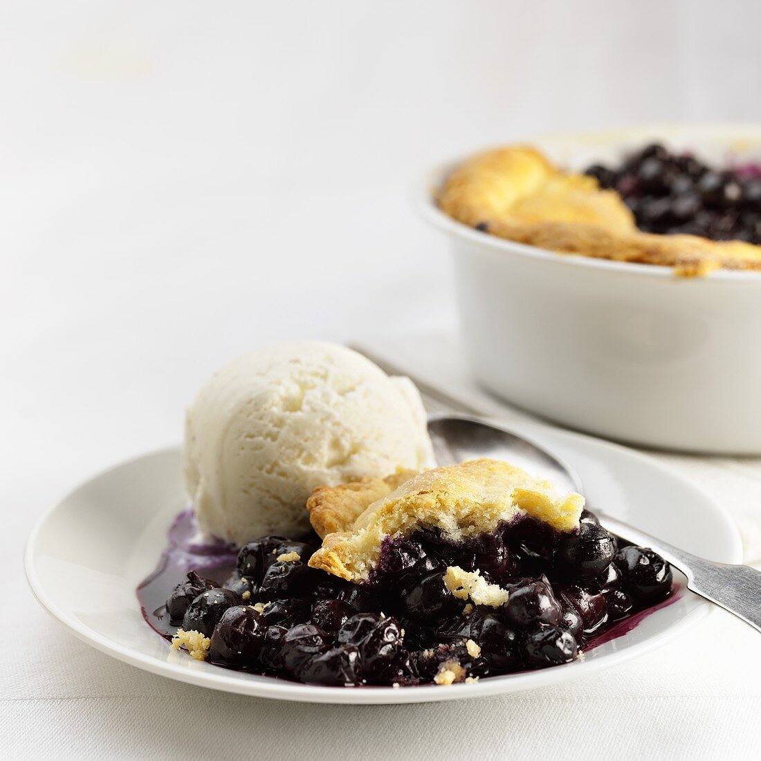 Blueberry cobbler (USA) with vanilla ice cream