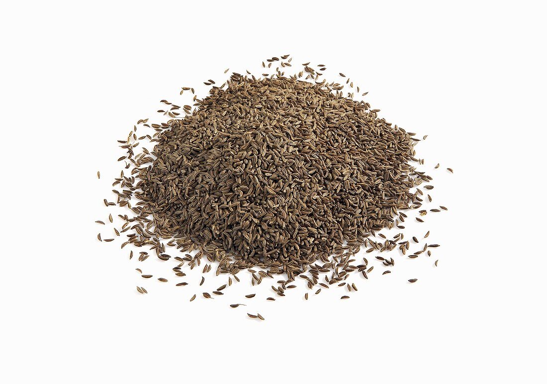 Pile of Caraway Seeds on White Background