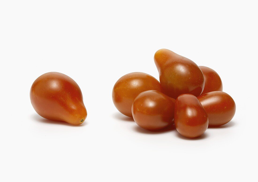 Pile of Red Teardrop Tomatoes on White Background