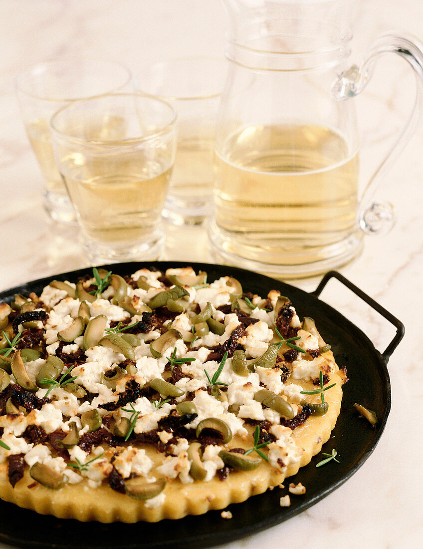 Flat Bread Topped with Feta Cheese, Green and Black Olives and Rosemary