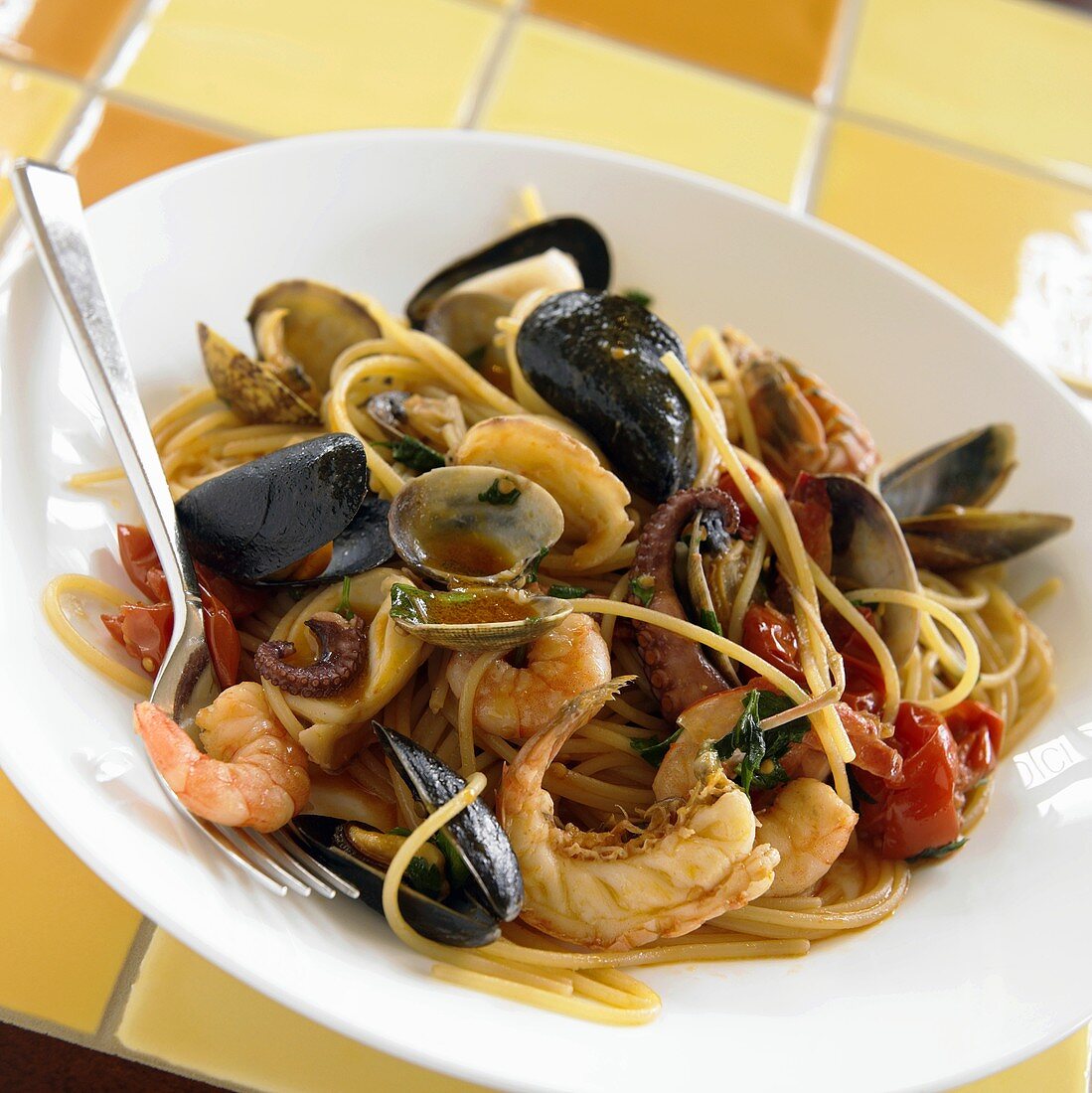 Seafood Pasta; Spaghetti With Assorted Shellfish on White Plate