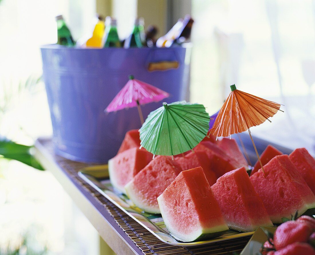 Watermelon wedges with cocktail umbrellas