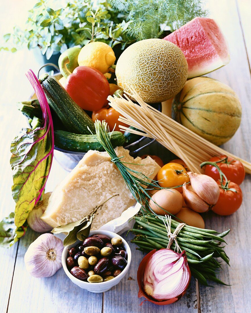 Still Life of Fresh Ingredients; Fruit, Vegetables, Pasta, Cheese and Olives