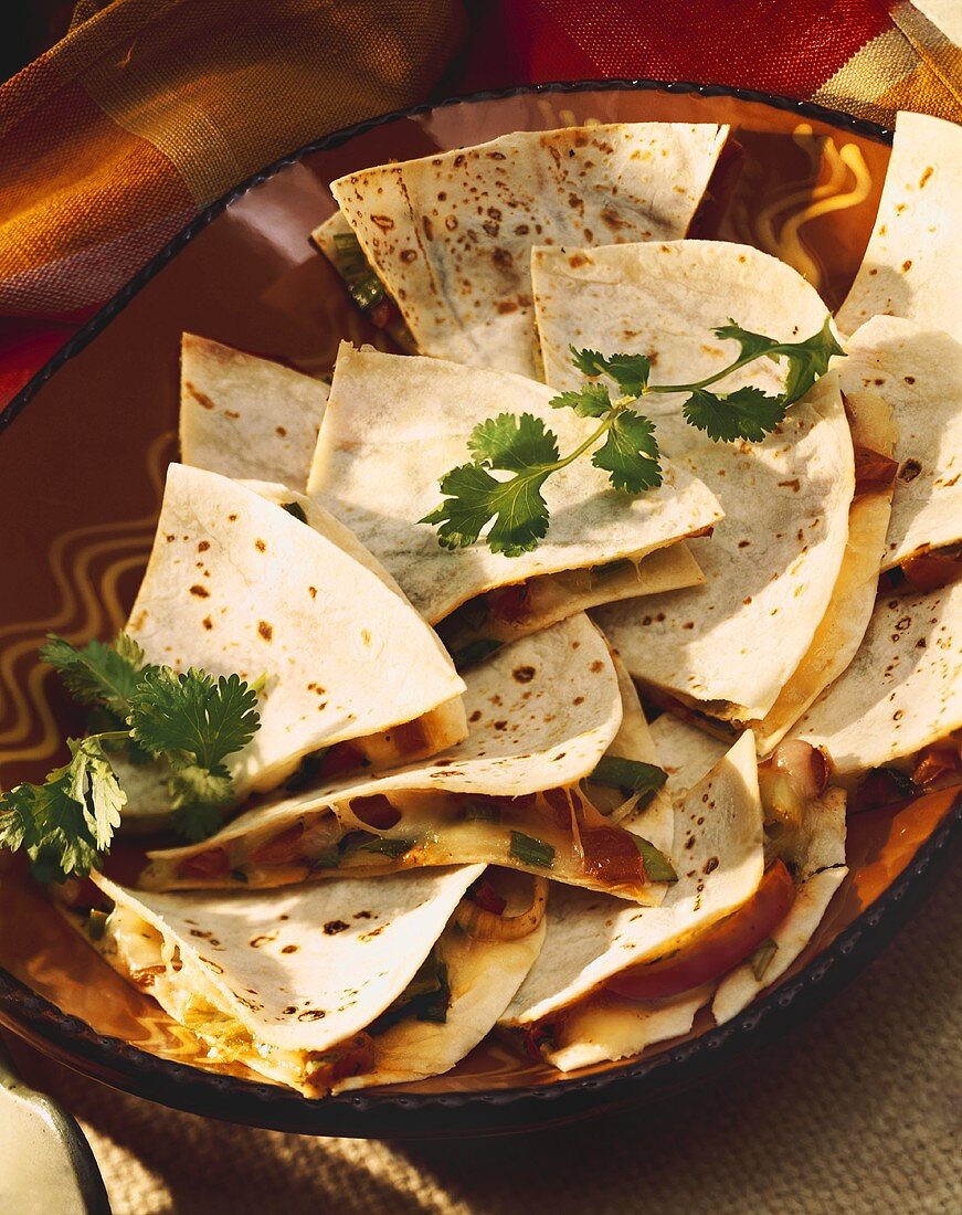 Platter of Cheese and Vegetable Quesadillas Sliced into Triangles