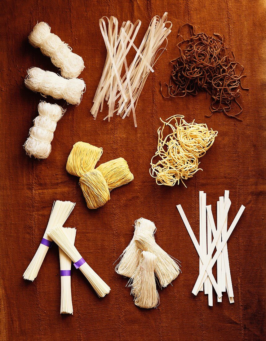 Overhead of Many Assorted Dried Noodles Used in Asian Cooking