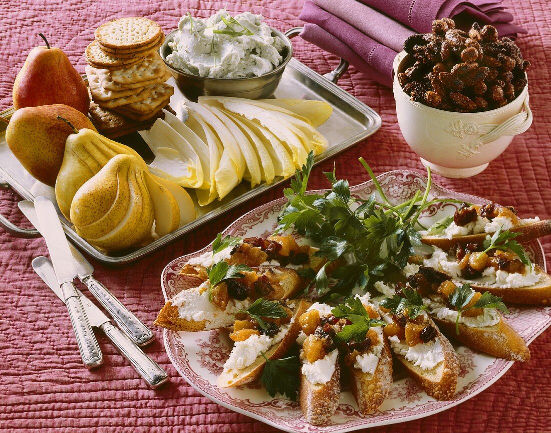 Holiday Hors d'oeuvres; Crackers with Cheese and Fruit, Roasted Nuts and Bread with Goat Cheese Spread