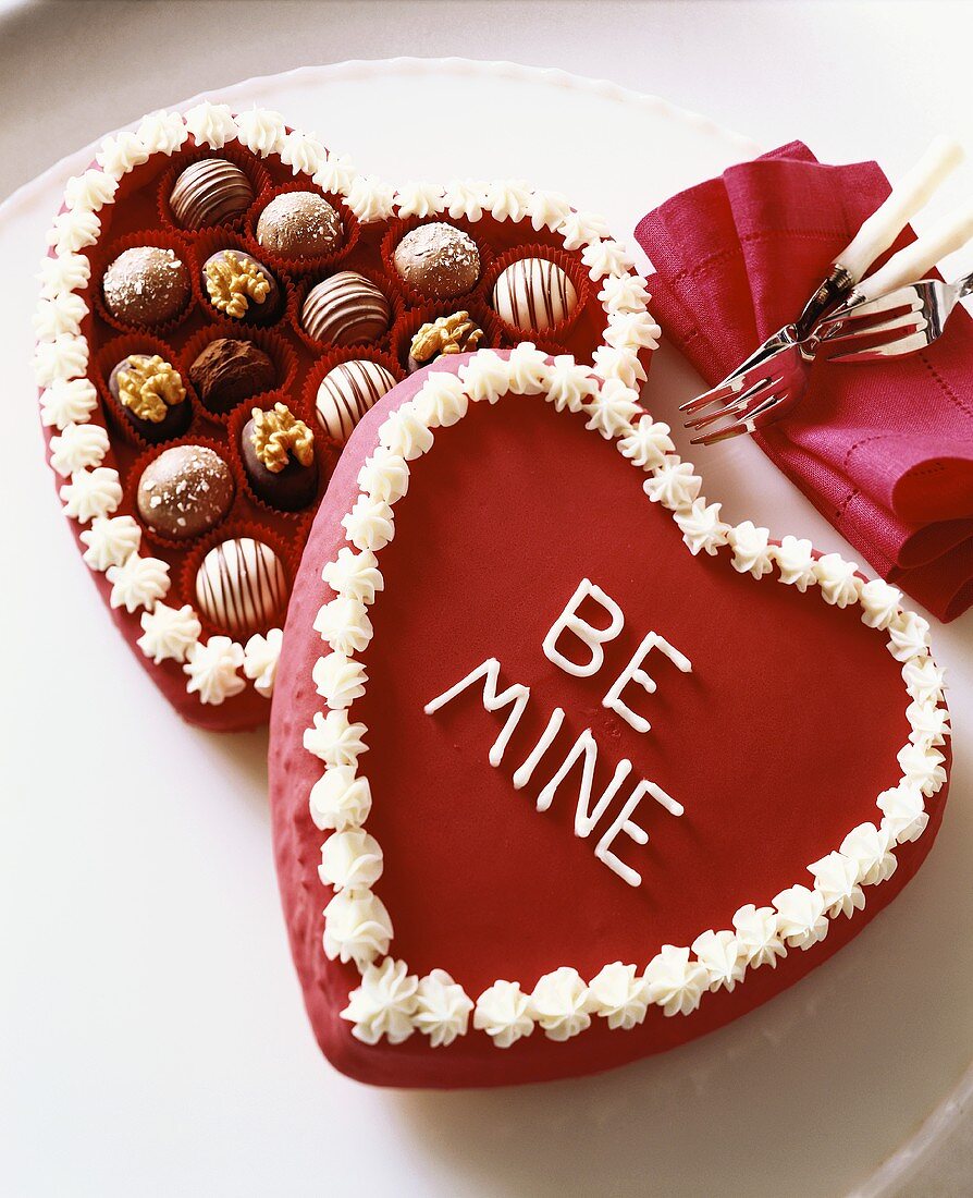 Assorted Chocolates in a Heart Shaped Cake that Says Be Mine for Valentines Day