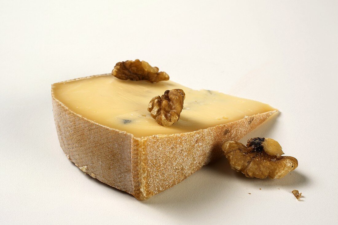 Slice of blue cheese with walnuts