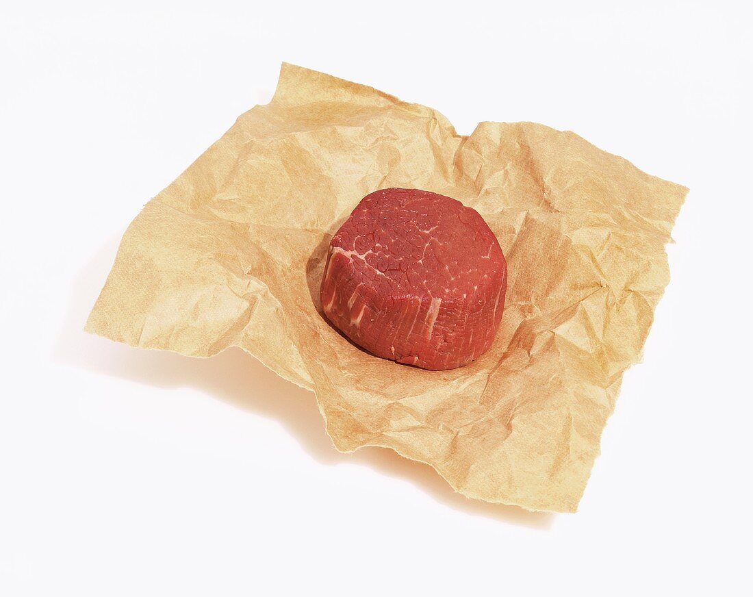 Small Beef Fillet on Butchers Paper on White Paper