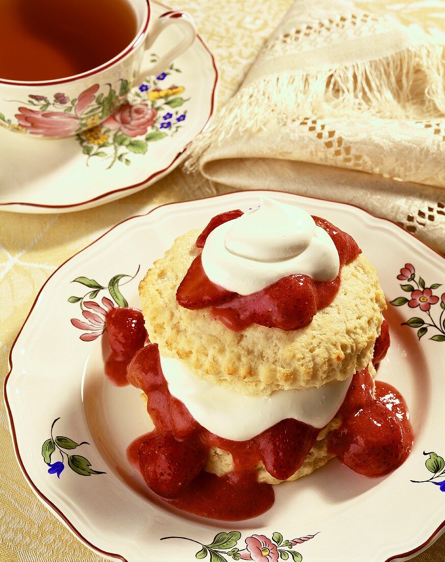 Strawberry Shortcake on a Plate with a Cup of Tea