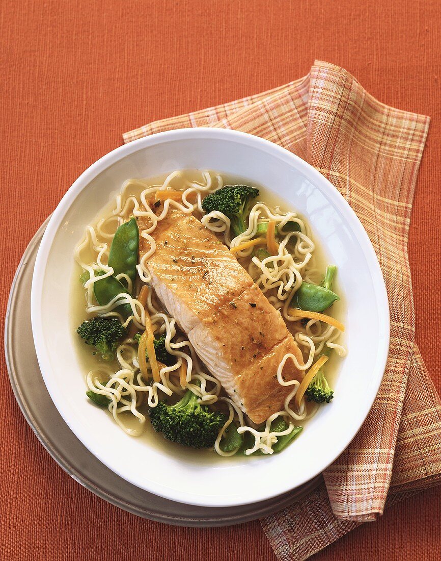 A Salmon Fillet in Broth with Noodles, Broccoli and Snow Peas