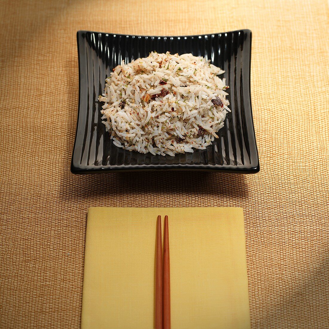 Asian Rice with Sun Dried Tomatoes on a Square Plate