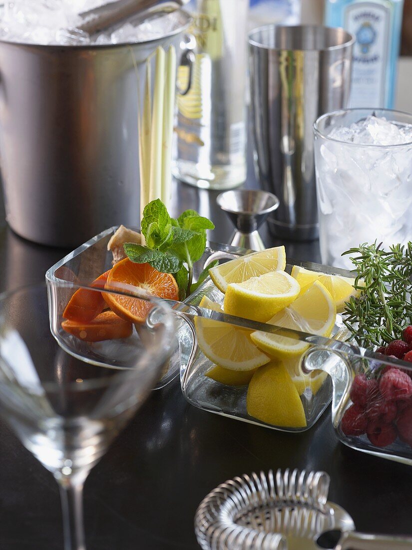 Bar Scene; Glasses, Ice, Shakers and Assorted Garnishes
