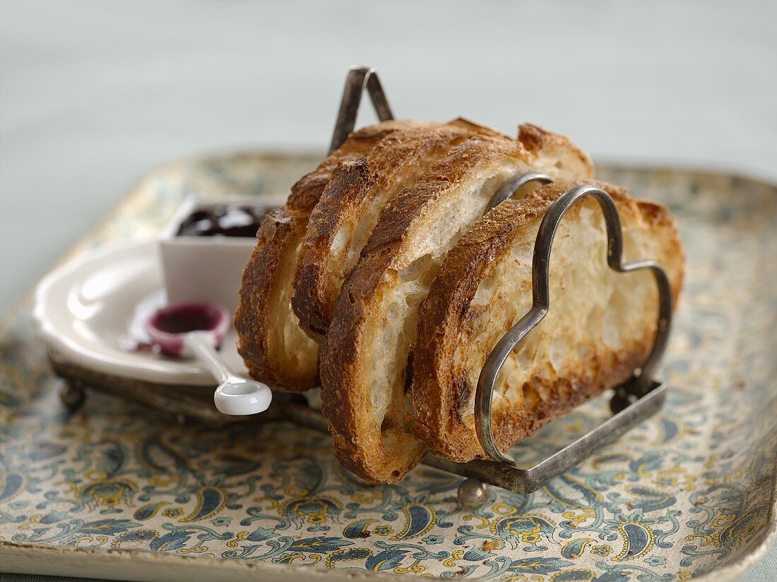 Toast Stacked in Toast Tray with Bowl of Jam