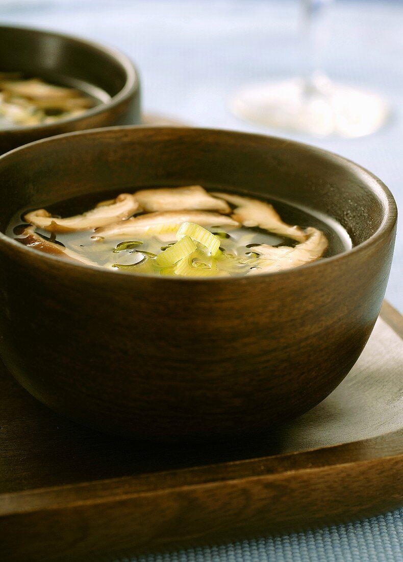Bowls of Miso Shitake Mushroom Soup Served in Wooden Bowls on Wooden Tray