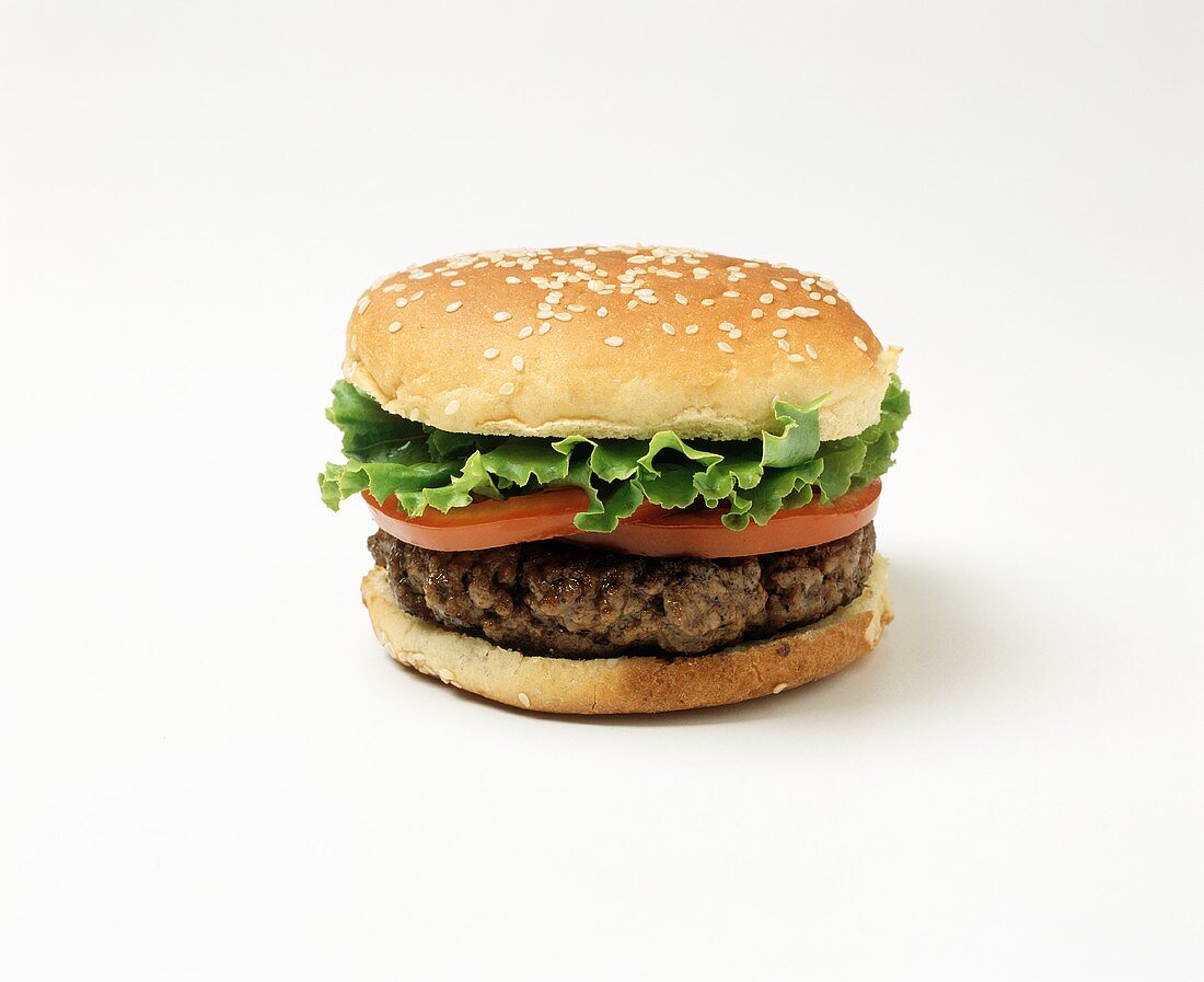 Hamburger with tomato and lettuce leaf