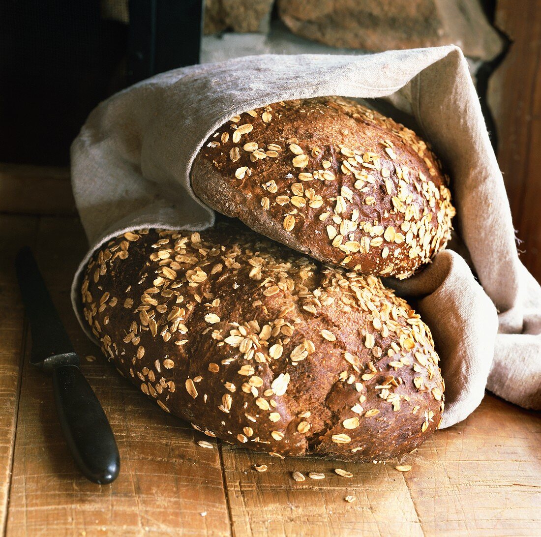 Two wholemeal loaves with rolled oats