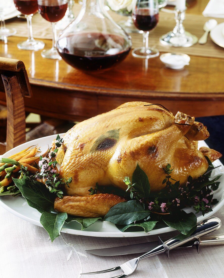 Roast turkey with herbs on platter