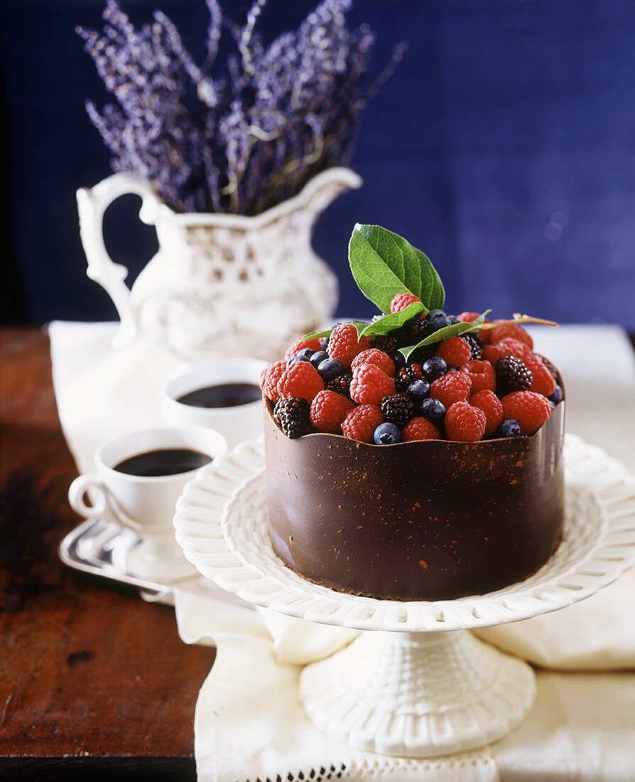 Berry cake with chocolate case, coffee