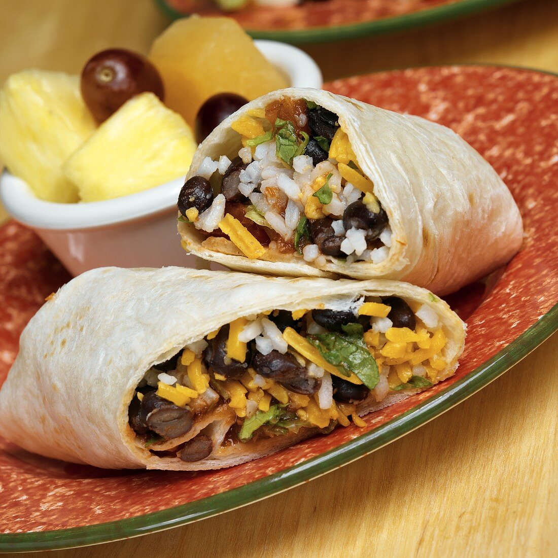 Burrito filled with cheese, black beans and rice